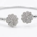 Close up preview of the motifs with embedded zirconia stones on this 925 sterling silver bracelet.