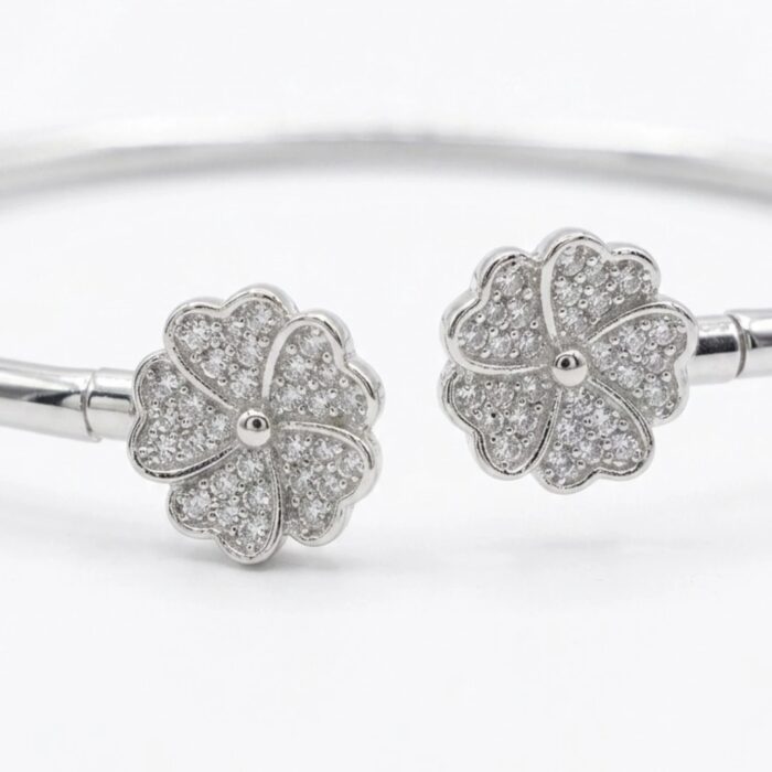 Close up preview of the motifs with embedded zirconia stones on this 925 sterling silver bracelet.