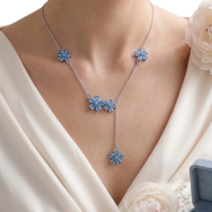 Elegant Rhodium plated Sterling silver necklace with Blue Zirconia Flowers