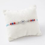 925 Sterling Silver Rakhi with embedded Zirconia stones on a Evil eye emblem
