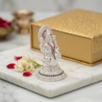 Side profile view of Pure silver Lakshmi Idol with embedded stones