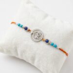 Silver Rakhi with zirconia stones