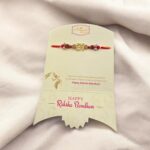 Om Rakhi with a Rakhi Greeting Card | Send Rakhi hamper to Canada
