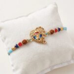 Close up of the Premium Ganesh Rakhi on beetel leaf