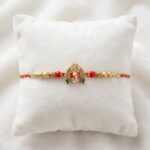 Close up of the Premium Ganesh Rakhi on beetel leaf