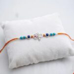 Send Sterling silver Rakhi with Ganesha