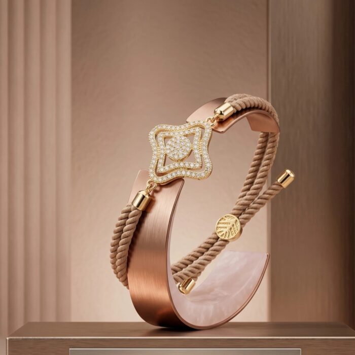 Adjustable woven cord bracelet with gold clover charm