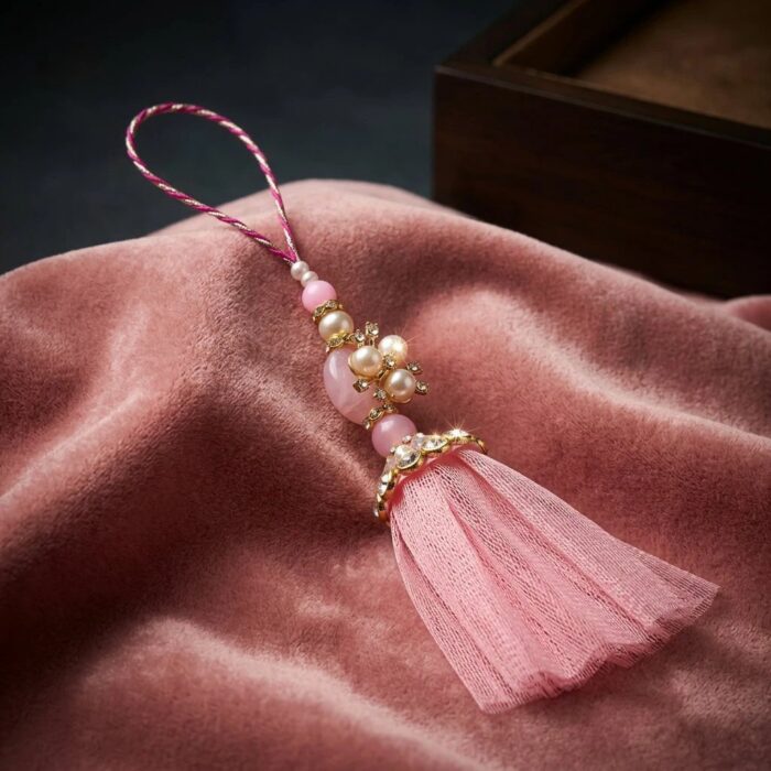 Close up of Pink tassel bag charm