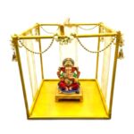 15 inch gold metal Ganpati makhar frame decorated with marigold garlands and a home Ganesh idol