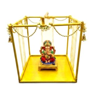 15 inch gold metal Ganpati makhar frame decorated with marigold garlands and a home Ganesh idol