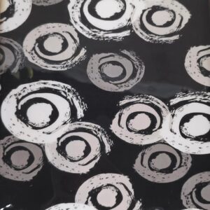 Eclipse Loops - Hand-scribbled white loops scattered over deep black gloss; modern, abstract, and unrepeatable
