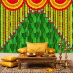 Close-up of banana leaves with marigold strings design — lush Kele Patta with orange-yellow marigold printed garlands pattern