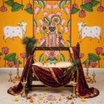 Close-up of Shrinath Ji Pichwai backdrop showing Nathdwara gold shringaar, cows and lotus flower border design