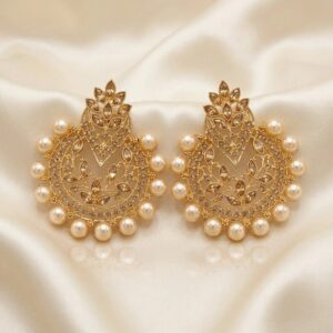 Gehna gold-tone chandbali earrings with cream-champagne pearls on ivory silk, front view
