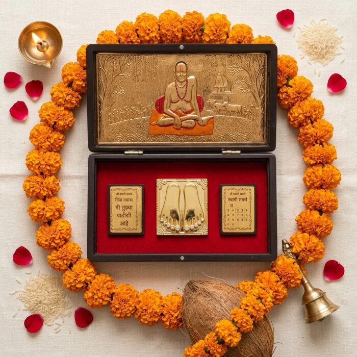 Open Swami Samarth gold plated gift box showing Swami Samarth and Charan Paduka