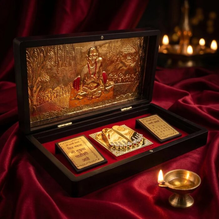 Open Swami Samarth gold plated gift box showing Swami Samarth and Charan Paduka