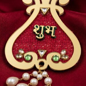 Close up on the Red Shubh labh on Golden Acrylic sheet