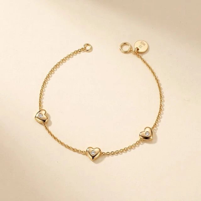 download (1).webp Elegant 925 Sterling Silver Gold-Plated Triple Heart Bracelet - Image 1
