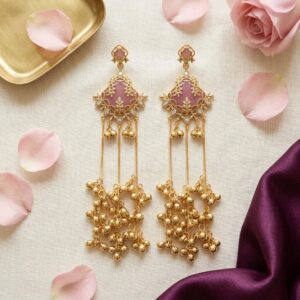 Rose pink onyx Kashmiri ghungroo earrings flat lay on ivory linen | Match your attire with these gold plated earrings
