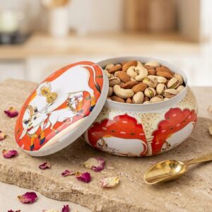 Red color - Open pichwai metal jar filled with dry fruits | Dry fruit serving jar