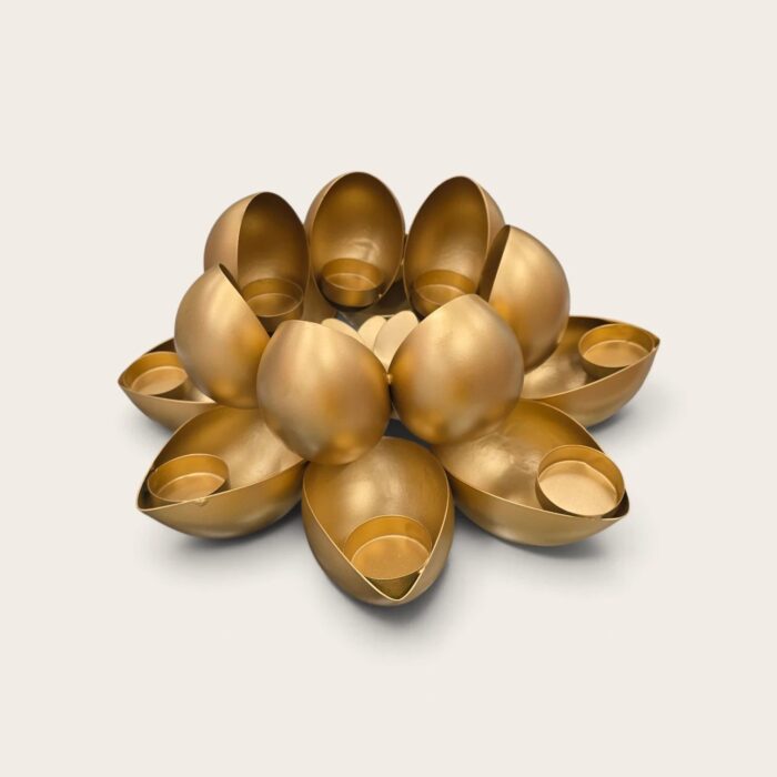 Matte gold lotus diya stand, two tiers of petal candle cups, unlit on white background