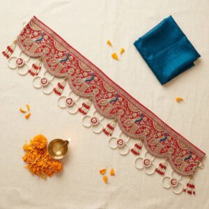 Red peacock gota patti toran bandhanwar with gold embroidery pearl loops and red tassels styled with diya and marigold