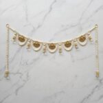 Pearl bandhanwar toran for main door front view with five gold charms pearl strings and crystal tassels