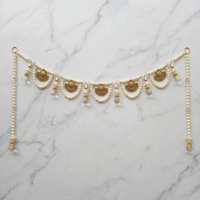Pearl bandhanwar toran for main door front view with five gold charms pearl strings and crystal tassels