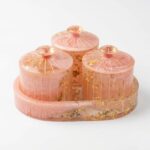 Miraya Pink resin dry fruit jar set with gold foil flakes - 3 airtight jars on an triangle serving trays