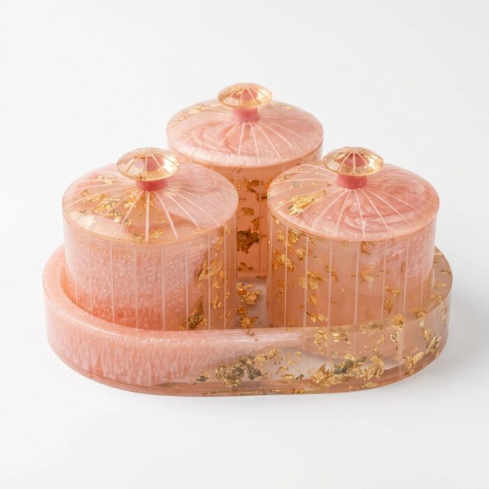 Miraya Pink resin dry fruit jar set with gold foil flakes - 3 airtight jars on an triangle serving trays